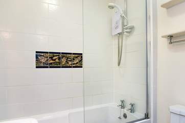 The bathroom is on the ground floor, just off the kitchen.