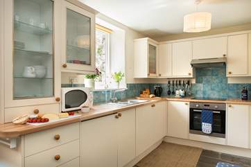 The delightful cottage kitchen is very well-equipped.
