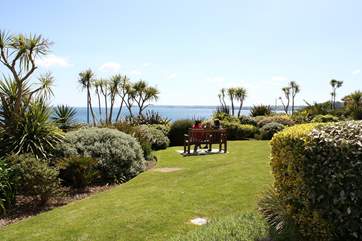 A perfectly placed bench allows you to admire the view from the communal garden in comfort!