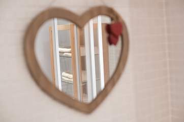 A pretty mirror in the bathroom.