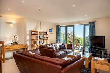 Open the double doors to the private patio and enjoy the sea air.