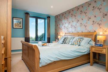 The master bedroom has a king size bed (Bedroom 1).