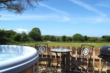 Meadow's private hot tub enclosure, with lovely views across the meadow and beyond.