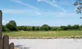 The lovely view across the meadow from the hot tub enclosure. - Thumbnail Image