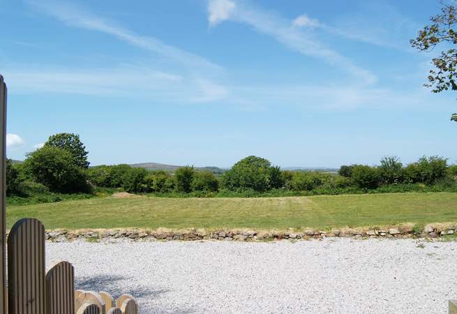 The lovely view across the meadow from the hot tub enclosures.