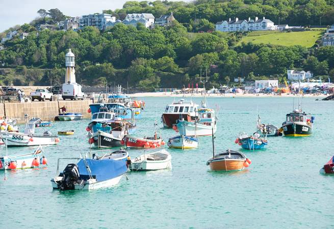 Visit the seaside town of St Ives with its stunning beaches and fishing boats.