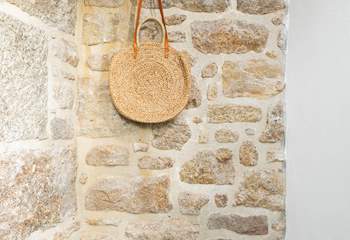 The stone cottage has an entrance porch to leave your sandy shoes behind.