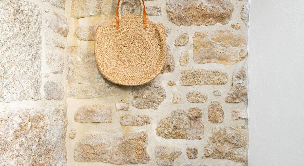 The stone cottage has an entrance porch to leave your sandy shoes behind.