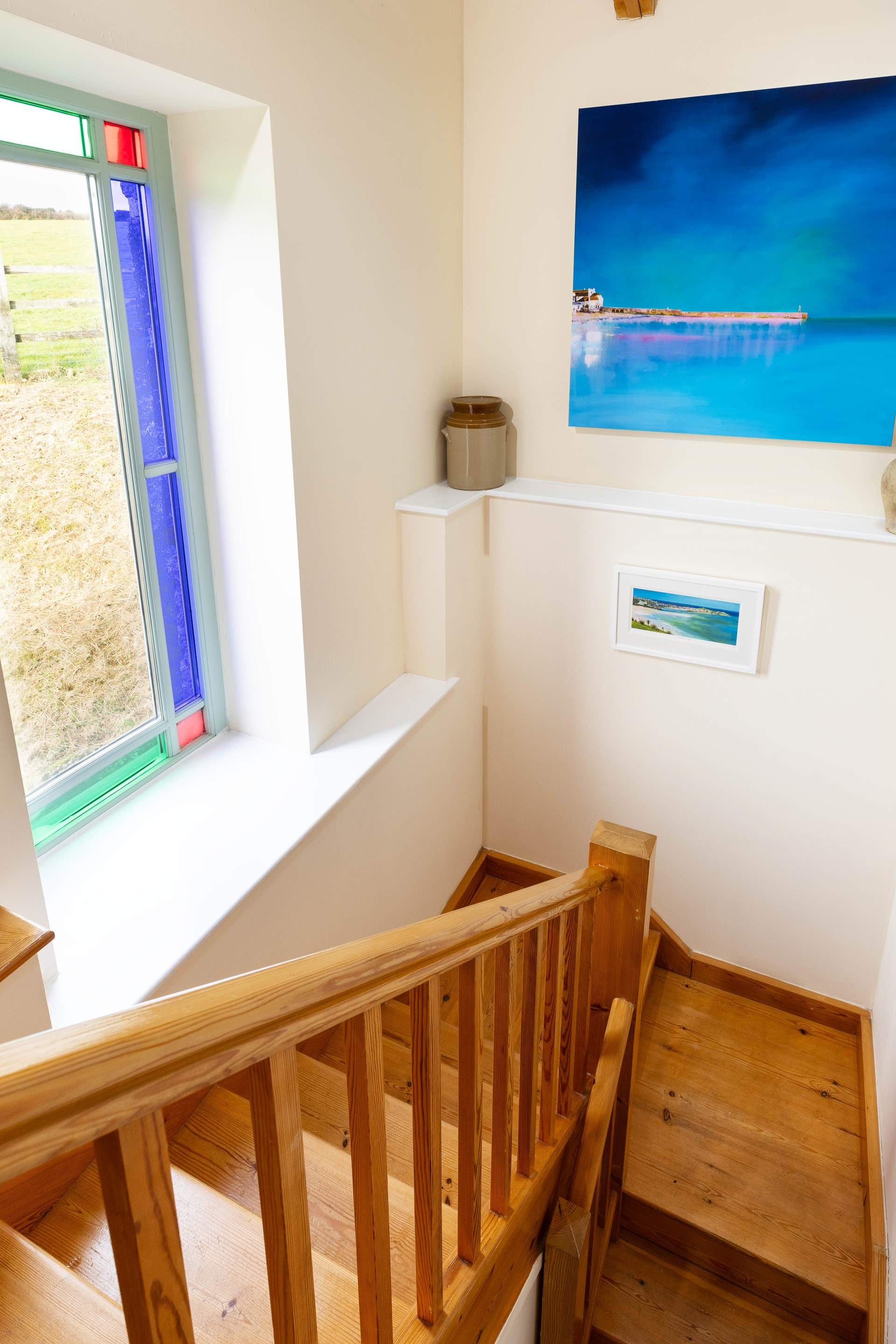 A wide and sturdy staircase lead you from the bedrooms to the open plan living area on the first floor.