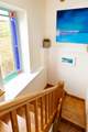 A wide and sturdy staircase lead you from the bedrooms to the open plan living area on the first floor.
