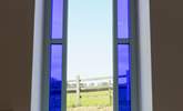 A feature stained glass window with beautiful views. - Thumbnail Image