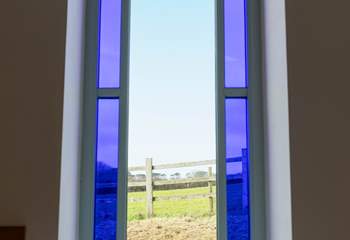 A feature stained glass window with beautiful views.