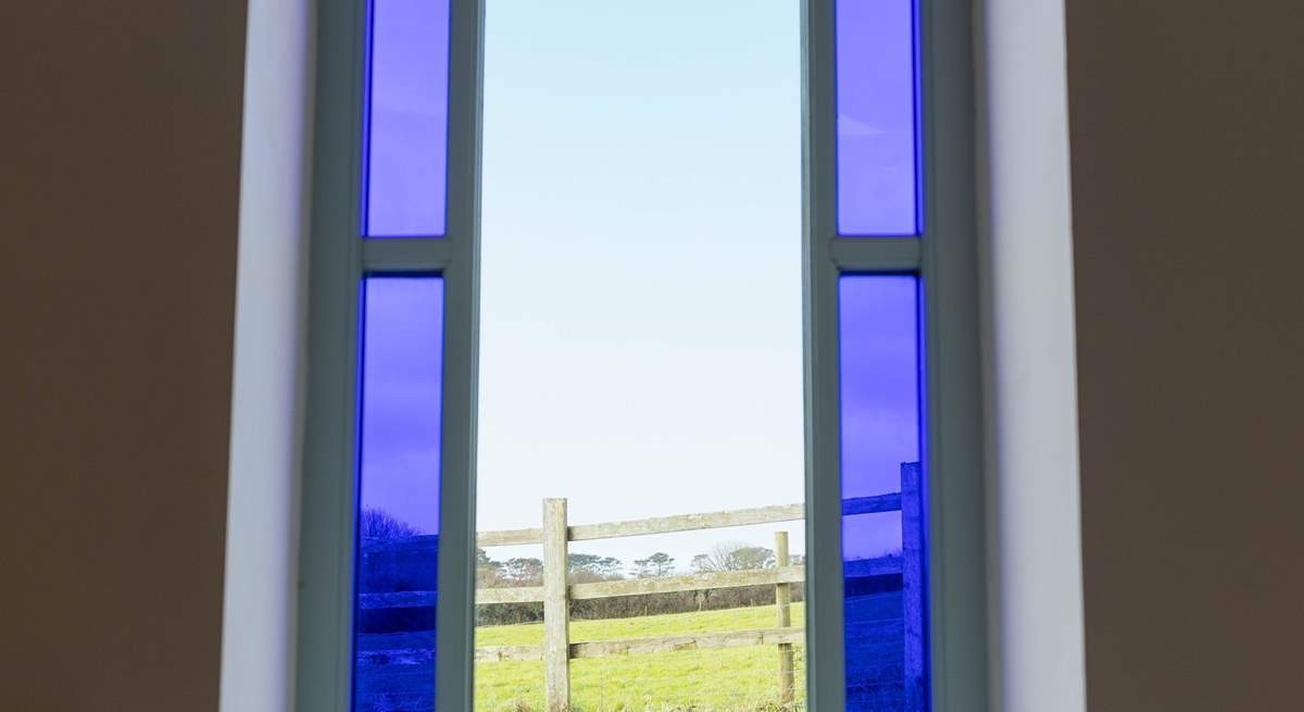 A feature stained glass window with beautiful views.