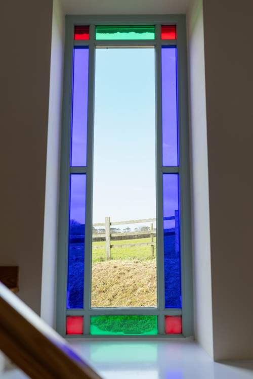 A feature stained glass window with beautiful views.