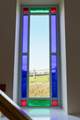 A feature stained glass window with beautiful views.