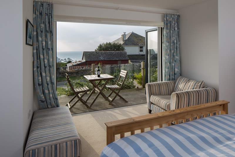 The ground floor double bedroom (Bedroom 1) has patio doors out to a small deck and some gorgeous views.