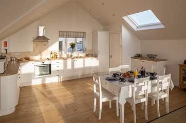 Light pours in to this well-equipped kitchen.