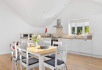 The kitchen offers oodles of space to whip up a feast and dine together in comfort.