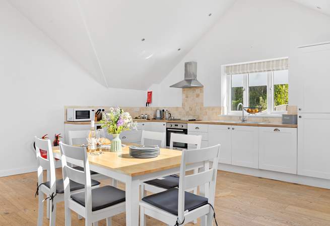 The kitchen offers oodles of space to whip up a feast and dine together in comfort.