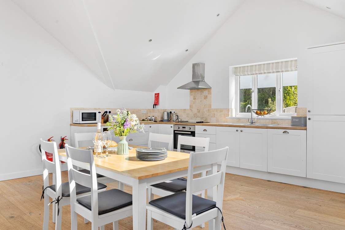 The kitchen offers oodles of space to whip up a feast and dine together in comfort.