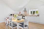 The kitchen offers oodles of space to whip up a feast and dine together in comfort.