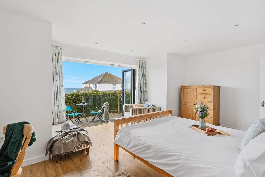 Bedroom 1 is home to a king-sized bed, with the added bonus of its very own patio-area. Perfect for enjoying a spot of breakfast in the sun.