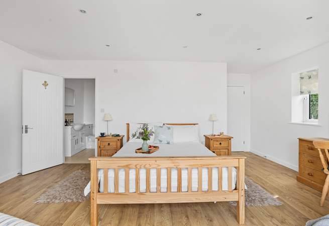 Bedroom 1 is rather spacious, boasting a private patio and an en suite shower-room.