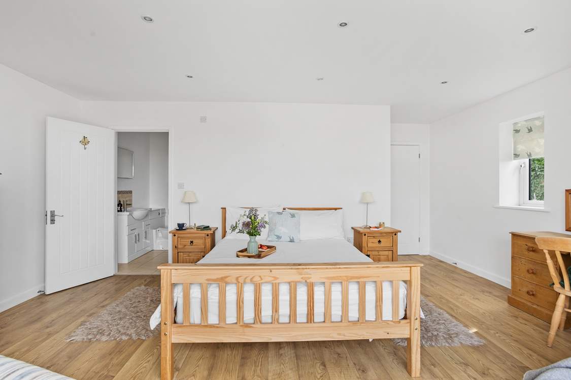 Bedroom 1 is rather spacious, boasting a private patio and an en suite shower-room.