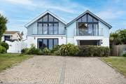 Spring Tide is the house on the right, with the balcony door open.