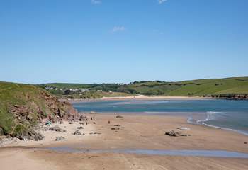 Bigbury beach looking over the stunning blue waters to Bantham beach. If you're a lover of water sports, these beaches are simply perfect for you.
