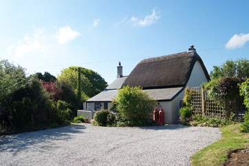 There is plenty of parking space in front of the cottage, with a five-barred gate at the entrance.