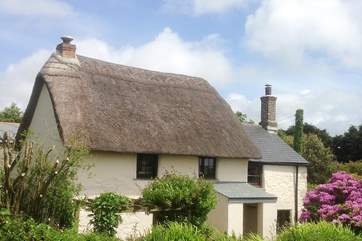 The cottage looks out onto fields and countryside views for miles.