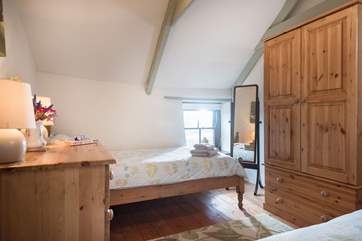 The comfortable twin bedroom also has views across the surrounding fields.