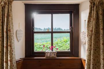 Views from the dining-room across the fields behind the cottage.
