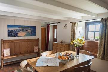 Between the dining-room and the sitting-room, the back door leads you out into the garden.