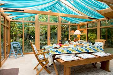 The large conservatory is a lovely room and overlooks the garden.