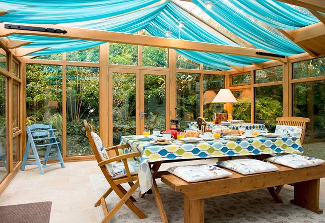 The large conservatory is a lovely room and overlooks the garden.