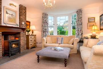 The comfy sitting-room has a lovely wood-burner making this an ideal retreat all year round.