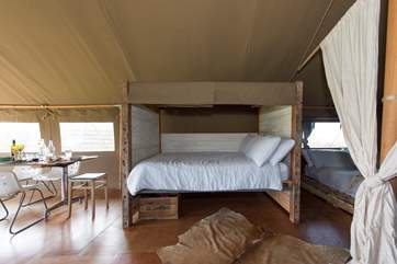 The double cabin bed with luxurious linens.