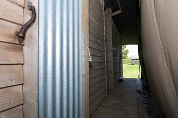 The bespoke en suite double shower-room and cloakroom can be accessed from inside the bedrooms or from the outside for those with sandy toes!