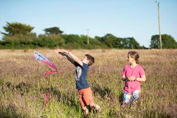 A holiday to remember running through long grass with freedom to explore.