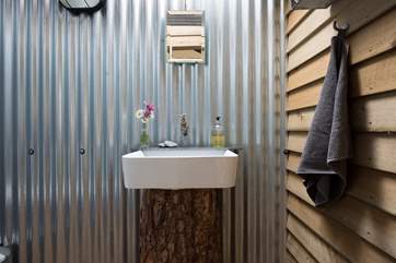 The cloakroom wash-basin.