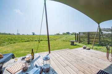 Sit on the deck and enjoy a glass of something.