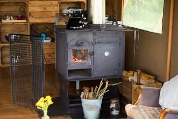 The log-fired range keeps the tent cosy and is capable of cooking a roast at the same time!
