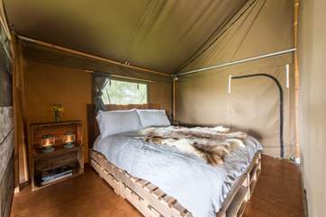 The cosy double bed, perfect for returning to after a day of exploring.