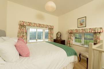 Up on the first floor the stairs open out into the dual-aspect main bedroom - more fabulous views from your bed.