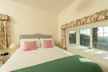 Another view of the main bedroom with its king-size bed.