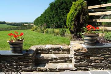 Shallow steps lead up to the extensive lawns which guests are welcome to use.