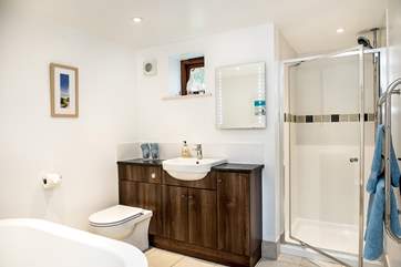 The ground floor family bathroom has a separate shower cubicle and free standing bath.