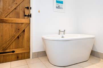 The stylish free-standing bath in the family bathroom.